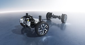 Fahrwerk und Antriebseinheit eines Foresters mit Rädern und Federung auf reflektierendem Untergrund