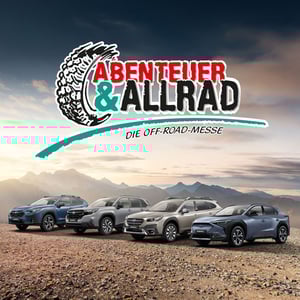 Abenteuer und Allrad Messe Logo mit Subaru-Range und Gebirge im Hintergrund
